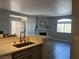 Bright kitchen with an island and modern finishes, open to the living area and a front door at 1830 N Buffalo Dr # 2022, Las Vegas, NV 89128
