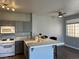 A well-lit kitchen with white countertops and a gas range at 1830 N Buffalo Dr # 2022, Las Vegas, NV 89128