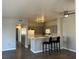 Open-concept living and kitchen area, maximizing space and flow for modern living at 1830 N Buffalo Dr # 2022, Las Vegas, NV 89128