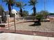 Stone monument sign for Pacific Legends featuring desert landscaping and towering palm trees at 1830 N Buffalo Dr # 2022, Las Vegas, NV 89128