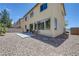 A private backyard features low maintenance landscaping, patio, and room for outdoor furniture at 1952 W Hammer Ln, North Las Vegas, NV 89031