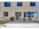 Backyard patio featuring outdoor seating, grill, with a sliding glass door leading into the home at 1952 W Hammer Ln, North Las Vegas, NV 89031