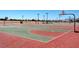 A community basketball court boasts vibrant colors, manicured landscaping, and ample lighting at 1952 W Hammer Ln, North Las Vegas, NV 89031