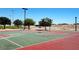 A community basketball court boasts vibrant colors, manicured landscaping, and ample lighting at 1952 W Hammer Ln, North Las Vegas, NV 89031