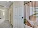 Hallway view leading to a well-lit bathroom and bedroom, showcasing the home's layout at 1952 W Hammer Ln, North Las Vegas, NV 89031