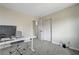 Office space with computer, desk and chair, closet with sliding door, and doorway at 1952 W Hammer Ln, North Las Vegas, NV 89031
