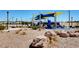 Enjoy the community playground with sun shades, surrounded by lush landscaping and walking paths at 1952 W Hammer Ln, North Las Vegas, NV 89031
