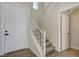 Entryway with a staircase featuring white railings and carpeting at 1952 W Hammer Ln, North Las Vegas, NV 89031