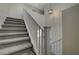 Carpeted staircase with white banister leading to the upper level at 1952 W Hammer Ln, North Las Vegas, NV 89031