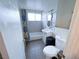 Bathroom with a combined shower and tub, vanity, and tiled walls at 2001 E Mcwilliams Ave, Las Vegas, NV 89101