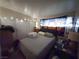 Cozy bedroom featuring a comfortable bed and tapestry accent wall at 2001 E Mcwilliams Ave, Las Vegas, NV 89101