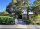 Charming single-story home with mature trees and landscaping creating curb appeal at 2001 E Mcwilliams Ave, Las Vegas, NV 89101