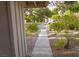 Inviting walkway lined with lush landscaping leads to the entrance of this charming home at 2001 E Mcwilliams Ave, Las Vegas, NV 89101