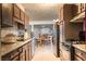The kitchen features dark cabinets, tile floors and stainless steel appliances at 2001 E Mcwilliams Ave, Las Vegas, NV 89101
