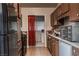 A view of the functional kitchen with modern appliances and access to a laundry area at 2001 E Mcwilliams Ave, Las Vegas, NV 89101
