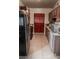 Functional kitchen layout with brown cabinets and modern appliances, creating a comfortable cooking space at 2001 E Mcwilliams Ave, Las Vegas, NV 89101