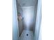 Bright bathroom shower features tiled walls and floor, handheld shower head, and practical storage at 2001 E Mcwilliams Ave, Las Vegas, NV 89101