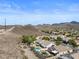 An aerial view of a desert community featuring homes with landscaped backyards and private pools at 2158 Shubert Ave, Henderson, NV 89052