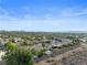 Expansive aerial view showcases a desert community with landscaped lots, mountain views and neighborhood pools at 2158 Shubert Ave, Henderson, NV 89052
