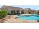 Backyard with pool, spa, patio, and tropical landscaping at 2158 Shubert Ave, Henderson, NV 89052