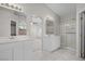 Well-lit primary bathroom with double sinks and a glass-enclosed shower at 2158 Shubert Ave, Henderson, NV 89052