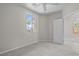 A well-lit bedroom provides neutral carpet and a window offering views of the outside at 2158 Shubert Ave, Henderson, NV 89052