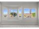 A bedroom view highlighting the custom window seat and exterior landscaping at 2158 Shubert Ave, Henderson, NV 89052