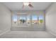Bright bedroom featuring neutral walls, plush carpet, and expansive windows with scenic views at 2158 Shubert Ave, Henderson, NV 89052