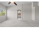Neutral bedroom featuring view window, carpet, and access to en-suite bathroom at 2158 Shubert Ave, Henderson, NV 89052