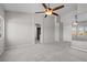 This bedroom includes neutral decor, plush carpet, and arched doorways to the bathroom at 2158 Shubert Ave, Henderson, NV 89052