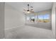 Spacious bedroom features a ceiling fan, carpet, and a charming bay window at 2158 Shubert Ave, Henderson, NV 89052