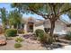 Charming single-story home featuring desert landscaping, a two-car garage, and a welcoming front entrance at 2158 Shubert Ave, Henderson, NV 89052