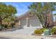 Quaint single-story home boasting a well-maintained front yard with flourishing plants and a two-car garage at 2158 Shubert Ave, Henderson, NV 89052