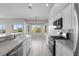 Lovely kitchen boasts bright countertops, stainless steel appliances, and backyard view at 2158 Shubert Ave, Henderson, NV 89052