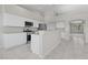 Modern kitchen with white cabinets, stainless steel appliances, and tile flooring at 2158 Shubert Ave, Henderson, NV 89052