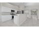 Updated kitchen features white cabinets, stainless steel appliances, breakfast bar, and tile flooring; a chef's dream space at 2158 Shubert Ave, Henderson, NV 89052
