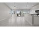 Open-concept living area with tile flooring and backyard views from the windows at 2158 Shubert Ave, Henderson, NV 89052