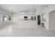 Bright, open space boasts tile floors, white trim, and connects the living and kitchen areas at 2158 Shubert Ave, Henderson, NV 89052