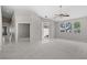 Spacious living room with tile and carpet, ceiling fan and lots of natural light at 2158 Shubert Ave, Henderson, NV 89052
