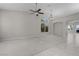Spacious living room with large windows providing natural light, neutral walls, and elegant archway to the rest of the home at 2158 Shubert Ave, Henderson, NV 89052