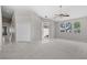 Spacious living room with tile and carpet, ceiling fan and lots of natural light at 2158 Shubert Ave, Henderson, NV 89052