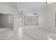Spacious living room with decorative windows and archway to bedrooms at 2158 Shubert Ave, Henderson, NV 89052