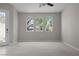 Bright and airy living room with arched windows offering a beautiful view at 2158 Shubert Ave, Henderson, NV 89052