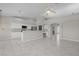 Bright living area with white kitchen, tile flooring, and an open floor plan at 2158 Shubert Ave, Henderson, NV 89052