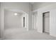 Spacious main bedroom with a ceiling fan, neutral carpet, and two closets with sliding doors at 2158 Shubert Ave, Henderson, NV 89052