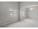 Large main bedroom provides neutral carpet, a ceiling fan, and two windows that offer natural light at 2158 Shubert Ave, Henderson, NV 89052