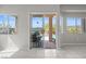 View of backyard pool and patio from bright, tile-floored living space at 2158 Shubert Ave, Henderson, NV 89052