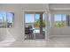 View of backyard pool and patio from bright, tile-floored living space at 2158 Shubert Ave, Henderson, NV 89052