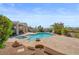 Beautiful backyard pool with mature landscaping and covered patio at 2158 Shubert Ave, Henderson, NV 89052