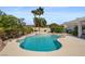 Inviting backyard pool and spa with lush tropical landscaping at 2158 Shubert Ave, Henderson, NV 89052